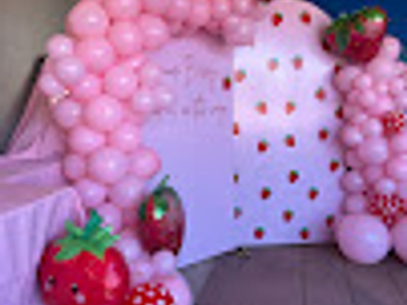 Pink baby shower decorations with balloons