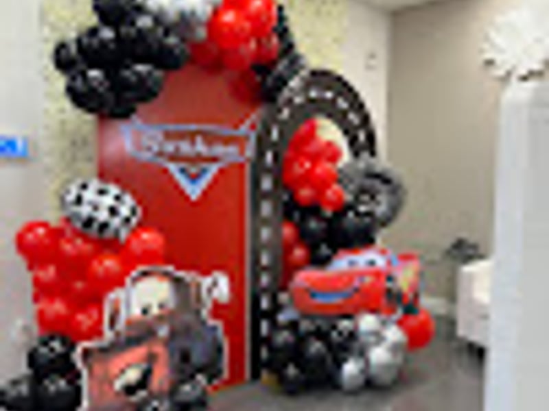 Racing car themed party with checkered decorations
