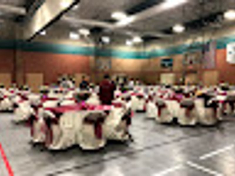 Formal corporate dining setup with round tables