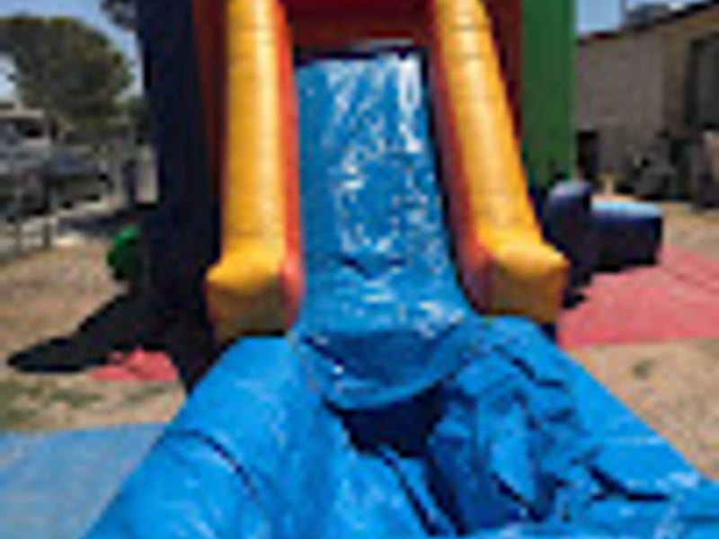Outdoor corporate event with water slide entertainment