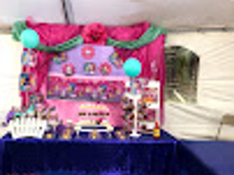 Purple themed quinceañera decorations