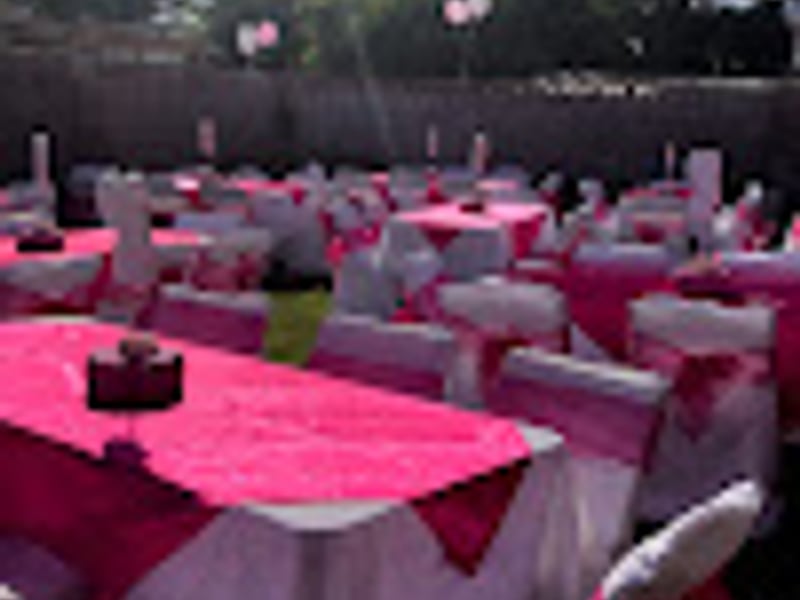 Pink themed wedding reception with elegant table settings