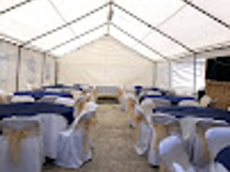 Formal white wedding setup with round tables